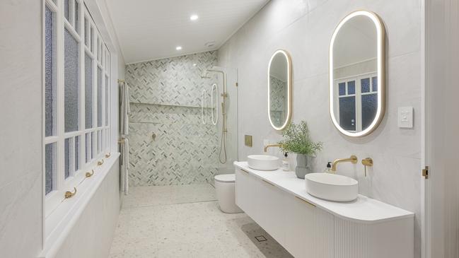 One of three bathrooms with the classic Queenslander windows retained.