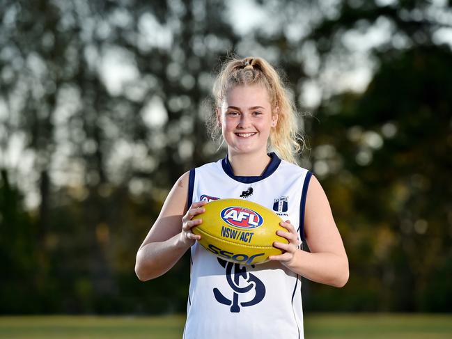 Talented junior AFL player Lauren Bird, 16, poses during a photo shoot at St Ives on Tuesday August 28th. Local Sports Star nominee Lauren Bird plays for St Ives in the U18 Youth Girls Sydney Harbour competition. (AAP IMAGE / Troy Snook)