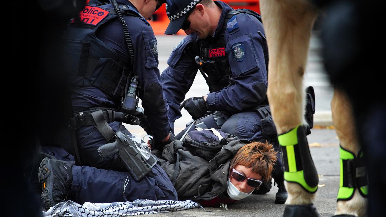 A number of protesters were seen taken to the ground by police. Picture: NCA NewsWire / Luis Enrique Ascui