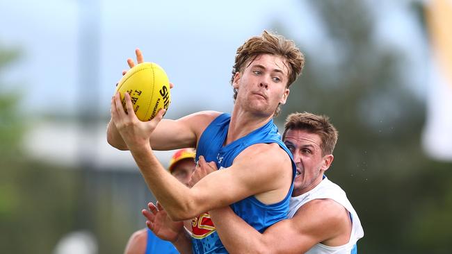 GOLD COAST, AUSTRALIA - FEBRUARY 27: Ethan Read is tackled by g24=during a Gold Coast Suns AFL training session at Austworld Centre Oval on February 27, 2024 in Gold Coast, Australia. (Photo by Chris Hyde/Getty Images)