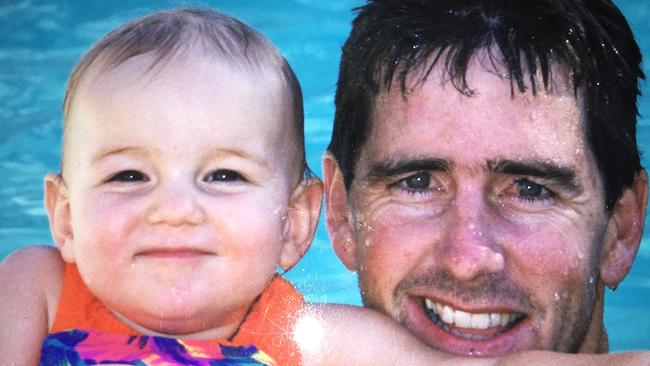 Young surfing world champion Rachael Tilly as a water baby with her father, former US competitive surfer Glen Tilly.