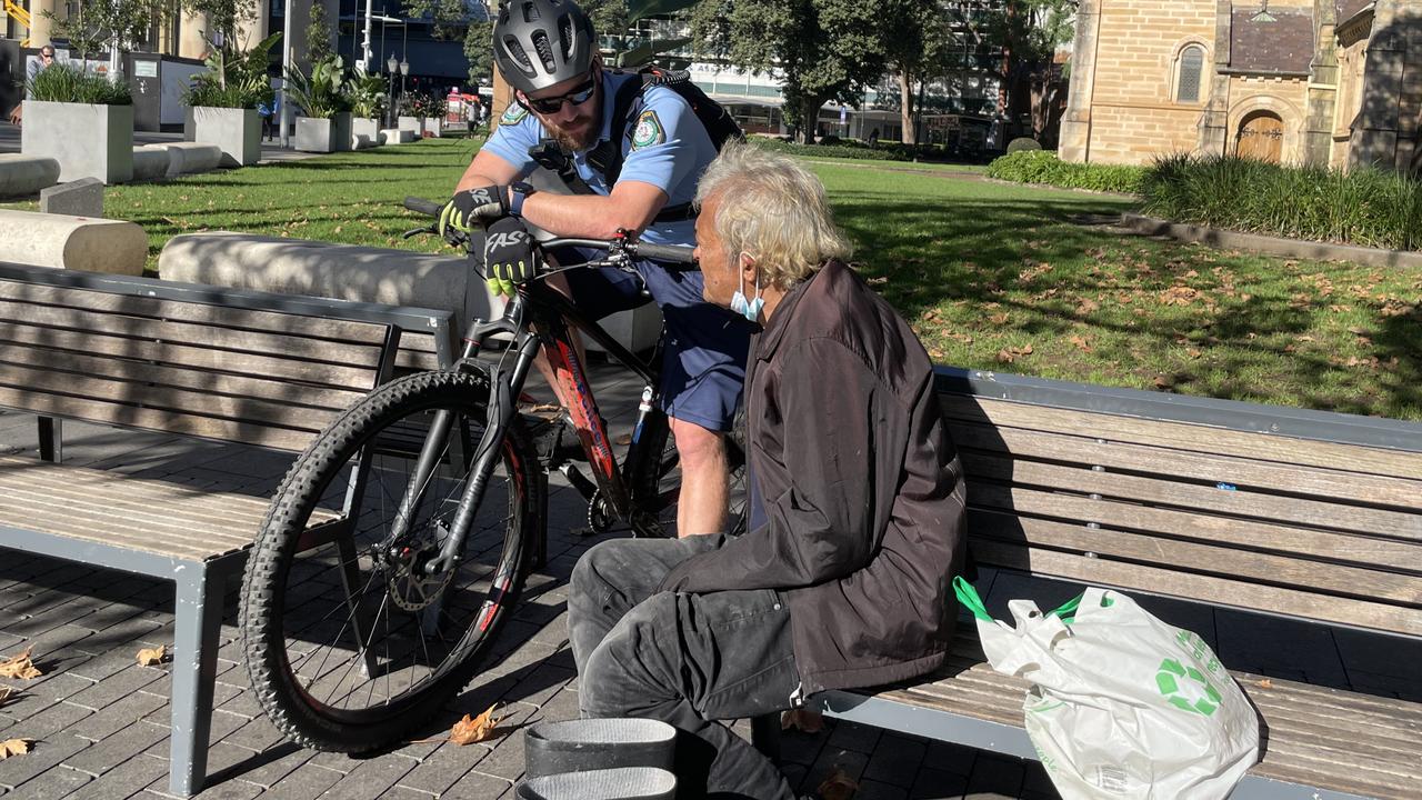 Parramatta police talking to a homeless man at Centenary Square Parramatta.