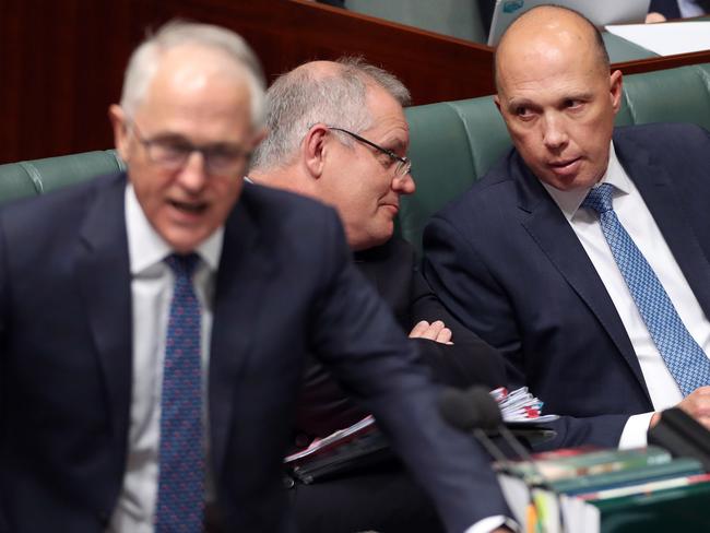 Malcolm Turnbull when he was PM as Scott Morrison chats with Peter Dutton during Question Time. Picture Gary Ramage