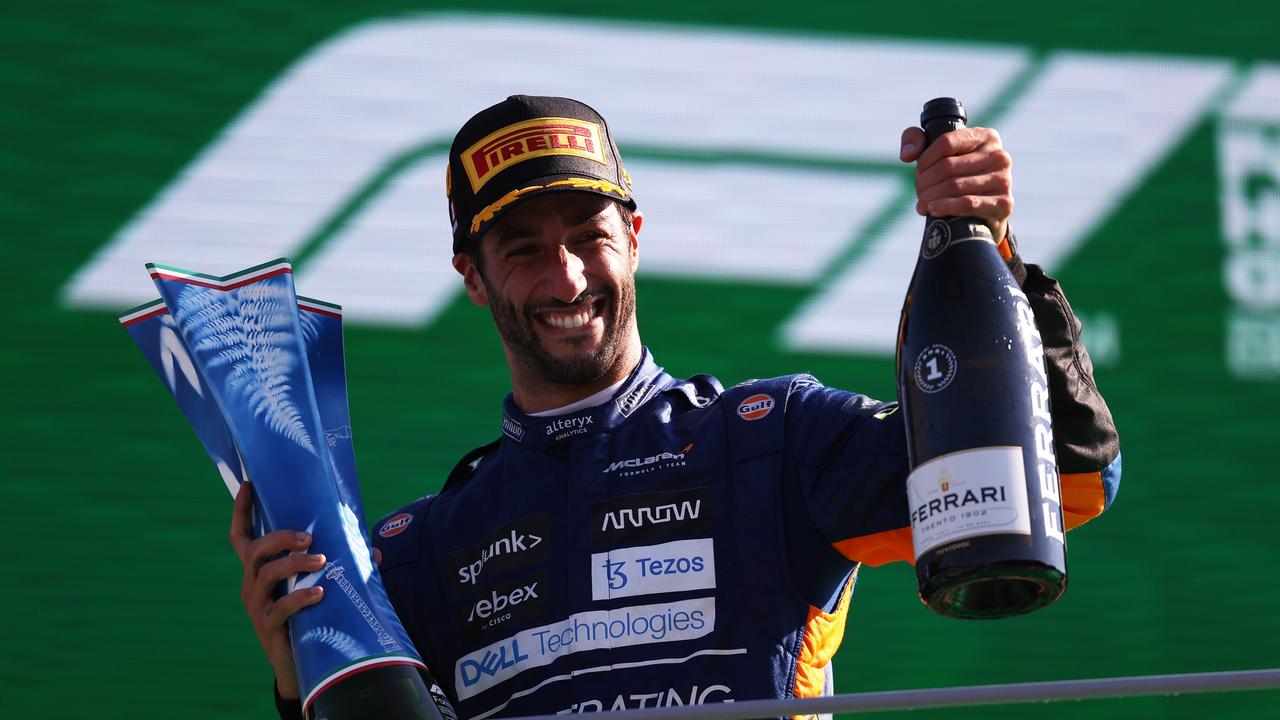 MONZA, ITALY - SEPTEMBER 12: Race winner Daniel Ricciardo of Australia and McLaren F1 celebrates on the podium during the F1 Grand Prix of Italy at Autodromo di Monza on September 12, 2021 in Monza, Italy. (Photo by Lars Baron/Getty Images)