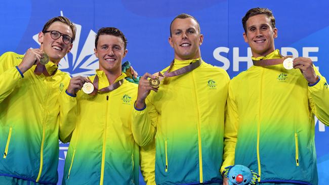 (L-R) Mack Horton, Elijah Winnington, Kyle Chalmers and Alexander Graham celebrate winning gold in the Mens 4 x 200m Freestyle Relay on day four of swimming competition at the XXI Commonwealth Games at Gold Coast Aquatic Centre. Photo: AAP