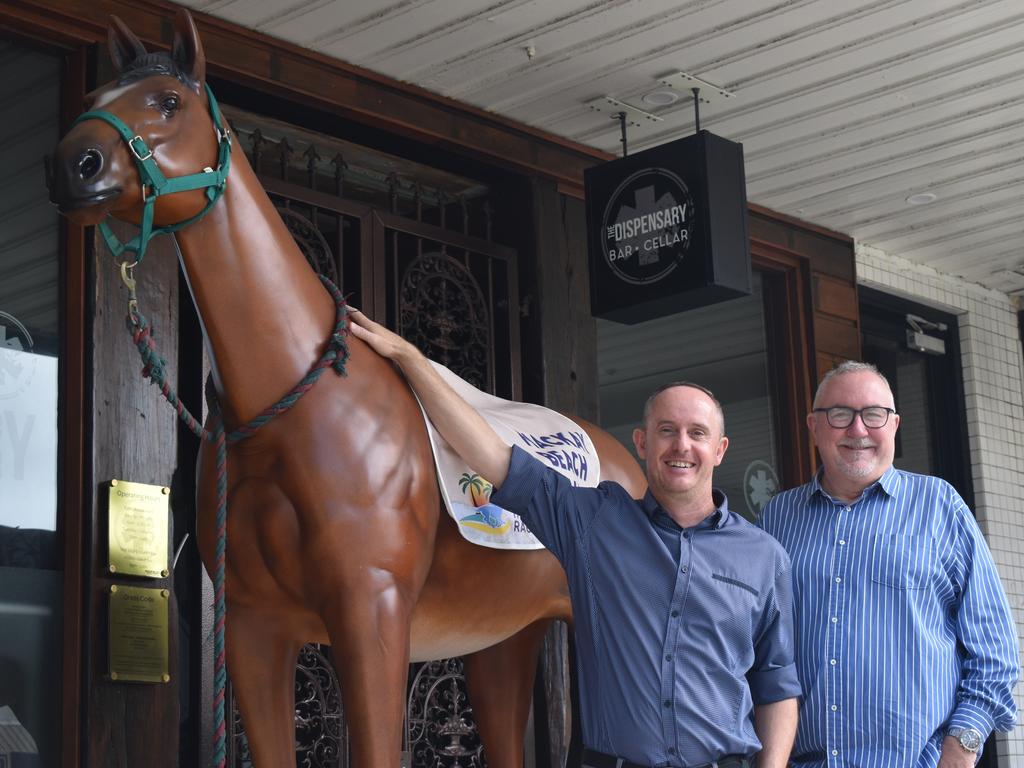 Mackay Beach Horse Races director James Dein and Mackay Tourism CEO Tas Webber at the front of The Dispensary promoting the Mackay Beach Horse Races, April 28, 2022. Picture: Lillian Watkins