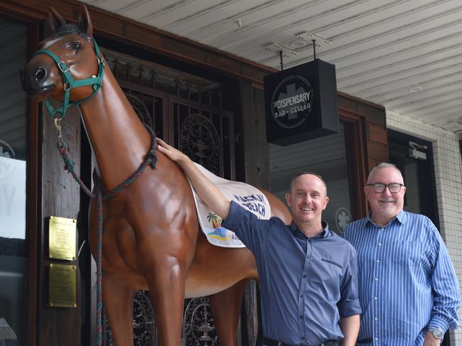 Mackay Beach Horse Races director James Dein and Mackay Tourism CEO Tas Webber at the front of The Dispensary promoting the Mackay Beach Horse Races, April 28, 2022. Picture: Lillian Watkins