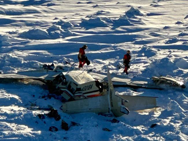 This image obtained from the US Coast Guard (USCG) on February 7, 2025, shows the remains of a plane reported missing February 6. The Bering Air Caravan was carrying nine passengers and one pilot on board. The search ended after the aircraft was located some 34 miles (55kms) southeast of Nome, Alaska. The USCG reported the three individuals were found inside and were deceased. "The remaining 7 people are believed to be inside the aircraft but are currently inaccessible due to the condition of the plane," according to a statement posted on the X of the USCG. (Photo by Handout / US Coast Guard / AFP) / RESTRICTED TO EDITORIAL USE - MANDATORY CREDIT "AFP PHOTO / US Coast Guard" - NO MARKETING NO ADVERTISING CAMPAIGNS - DISTRIBUTED AS A SERVICE TO CLIENTS