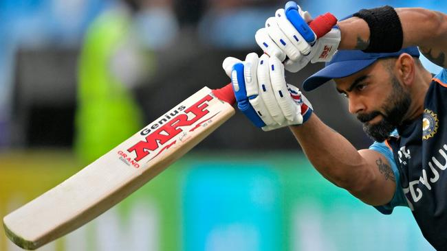 Virat Kohli warms up before India’s match against New Zealand at the Dubai International Cricket Stadium in Dubai on Sunday. Picture: AFP