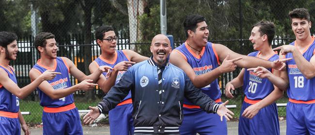 The senior basketball players with their coach Joseph De Guia. Picture: Carmela Roche