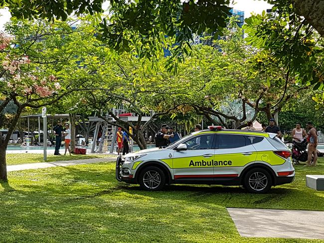 Queensland Ambulance Service officers at the scene of a drowning in the Cairns lagoon on December 23. Picture: Brendan Radke