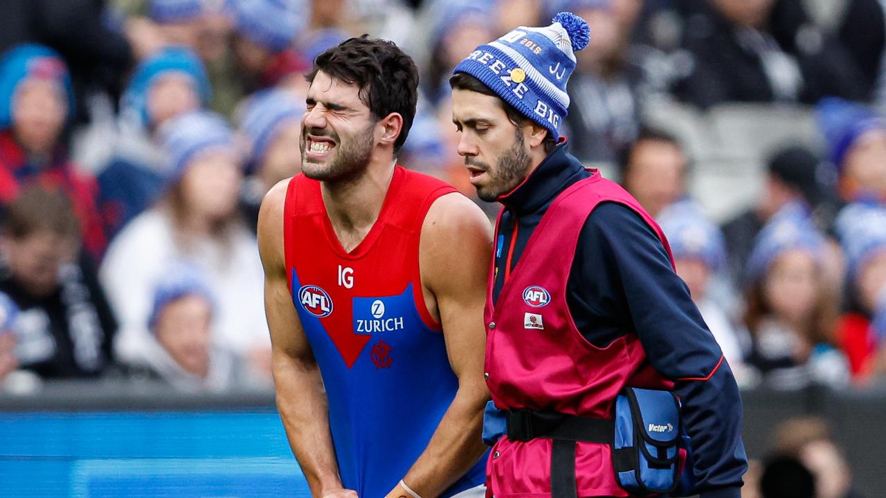 MELBOURNE, AUSTRALIA - JUNE 10: Christian Petracca of the Demons leaves the field injured during the 2024 AFL Round 13 match between the Collingwood Magpies and the Melbourne Demons at The Melbourne Cricket Ground on June 10, 2024 in Melbourne, Australia. (Photo by Dylan Burns/AFL Photos via Getty Images)