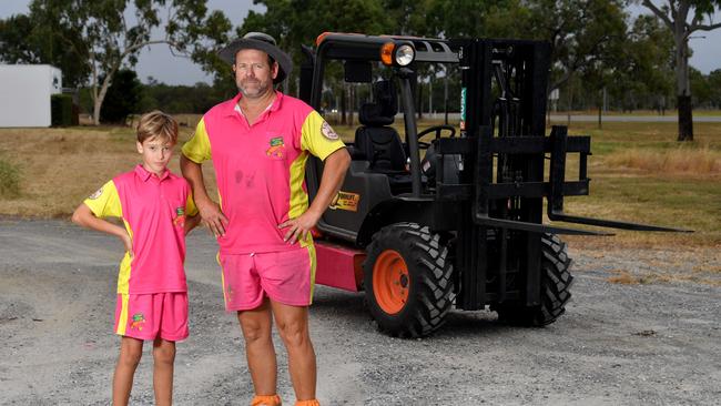 Brent Stevenson with his son Klay, 10, and one of his transport business's forklifts. Picture: Evan Morgan