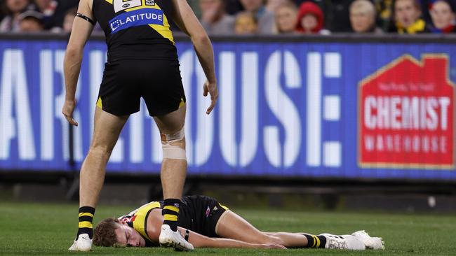 Sam Banks was knocked out in a brutal collision during the third quarter of Richmond’s loss to the Western Bulldogs but was on his feet on the boundary line at the end of the game. Picture: Darrian Traynor / Getty Images