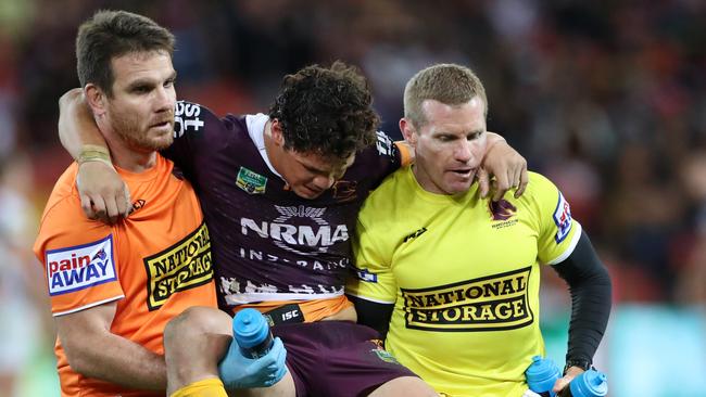 James Roberts is carried off during the Broncos win over the Panthers. Picture: Darren England
