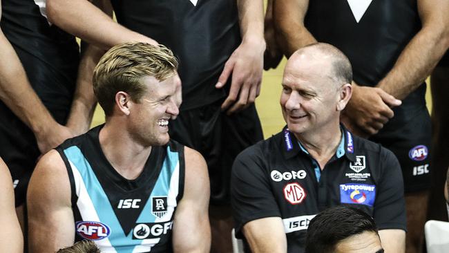 Captain Tom Jonas and coach Ken Hinkley chat during the team photo day. Picture: Sarah Reed