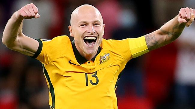 DOHA, QATAR - JUNE 13: Aaron Mooy of Australia celebrates their sides victory after a penalty shoot out following the 2022 FIFA World Cup Playoff match between Australia Socceroos and Peru at Ahmad Bin Ali Stadium on June 13, 2022 in Doha, Qatar. (Photo by Mohamed Farag/Getty Images)