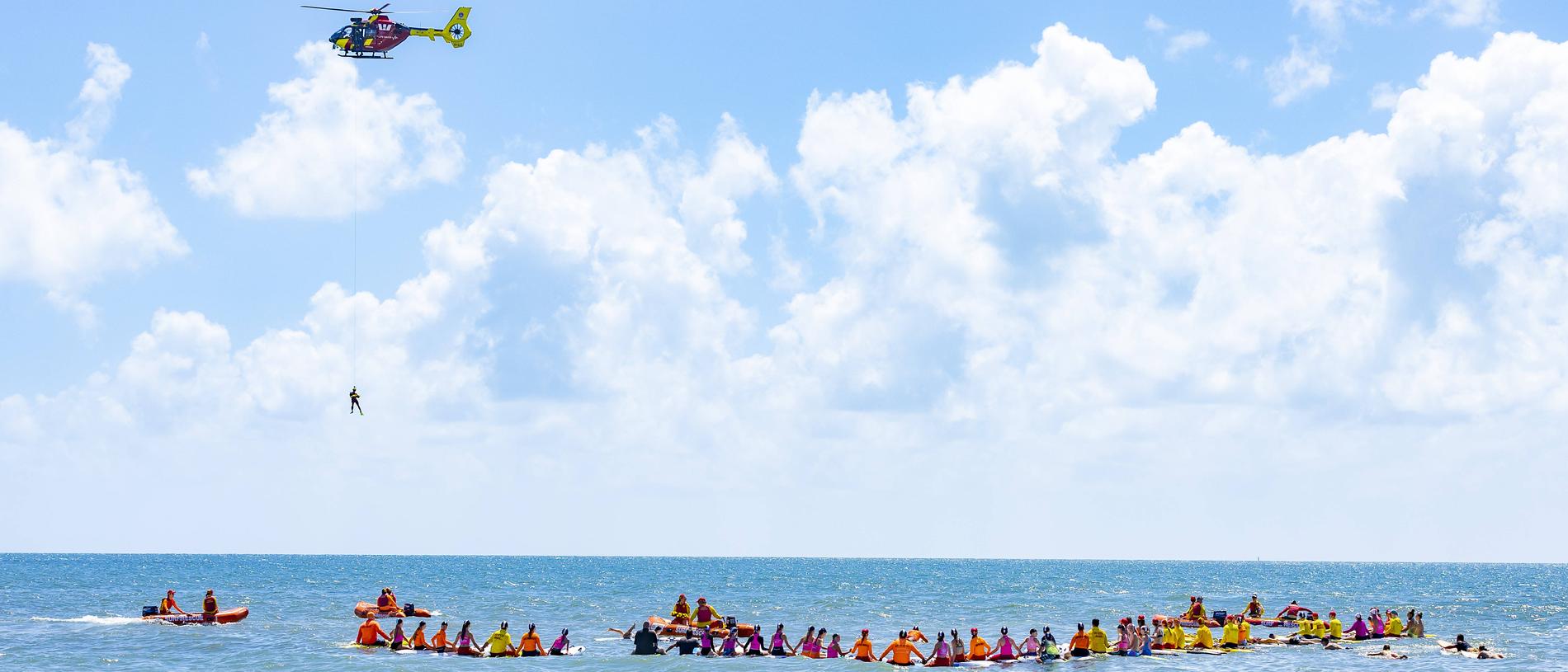A public memorial at Bribie Island Surf Life Saving Club on Sunday for shark attack victim Charlize Zmuda. Picture: Richard Walker
