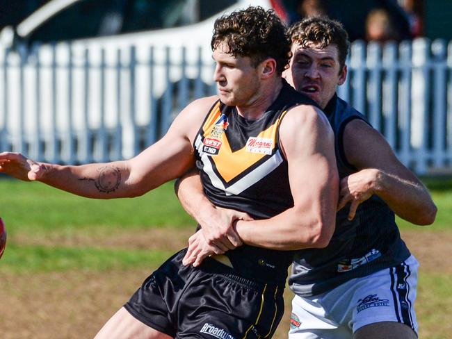 AUGUST 21, 2021: BrightonÃs Otis Carthy kicks under pressure during Adelaide Footy League division one match between Brighton Bombers and Port District at Brighton Oval. Picture: Brenton Edwards