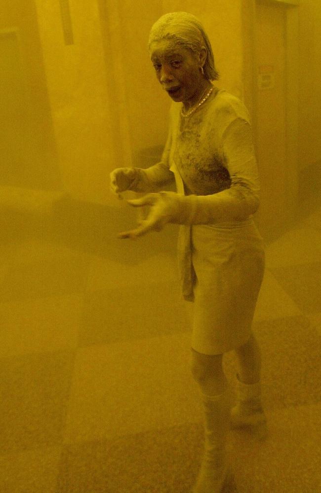 Marcy Borders covered in dust as she takes refuge in an office building after one of the World Trade Centre towers in New York collapsed. Picture: AFP Photo/Stan Honda