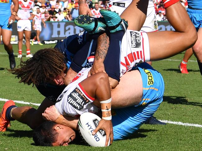 Tim Lafai gets the ball down to score one of his three tries for the Dragons.