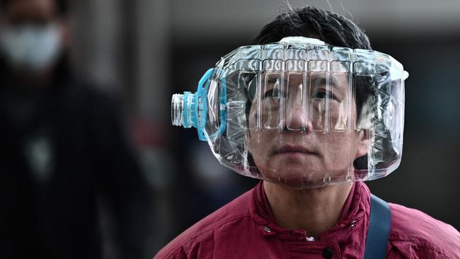 A woman with a home-made solution to COVID-19 protection in Hong Kong in January 31. Picture: AFP