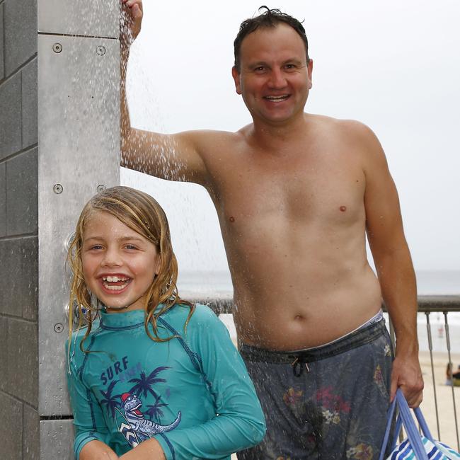 Dad Oliver and Zach Harvey were spotted having fun in Surfers Paradise. Picture: Tertius Pickard