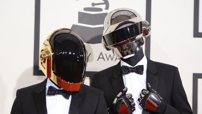 Daft Punk arrive on the red carpet for the 56th Grammy Awards at the Staples Center in Los Angeles. Picture: AFP