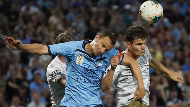 Melbourne City’s Curtis Good, right, contests a header against Alex Wilkinson during the club’s 2-1 loss to Sydney FC on Sunday Picture: AAP