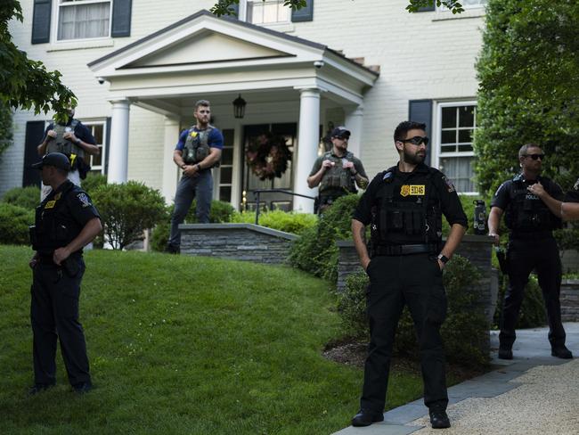 Police stand guard as abortion rights activists march in front of Supreme Court Chief Justice John Roberts' house on June 29, in Maryland. Picture: Getty Images