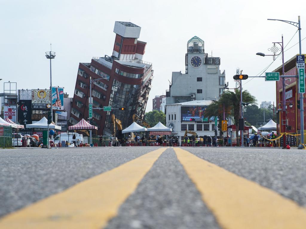 CORRECTION / This picture shows a slanted building caused by the earthquake in Hualien on April 4, 2024. At least nine people were killed and more than 1,000 injured by a powerful earthquake in Taiwan that damaged dozens of buildings and prompted tsunami warnings as far as Japan and the Philippines before being lifted. (Photo by Sam Yeh / AFP) / âThe erroneous mention[s] appearing in the metadata of this photo by Sam Yeh has been modified in AFP systems in the following manner: [removing the restrictions]. Please immediately remove the erroneous mention[s] from all your online services and delete it (them) from your servers. If you have been authorized by AFP to distribute it (them) to third parties, please ensure that the same actions are carried out by them. Failure to promptly comply with these instructions will entail liability on your part for any continued or post notification usage. Therefore we thank you very much for all your attention and prompt action. We are sorry for the inconvenience this notification may cause and remain at your disposal for any further information you may require.â