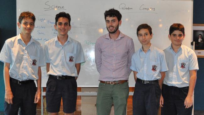 Quantum physicist Dr Dylan Saunders (middle) with Year 9 St Augustine's College students. He graduated from the College in 2004.