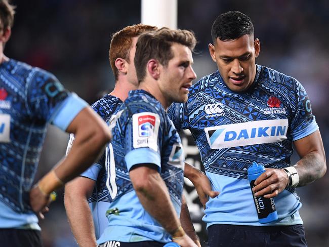 A dejected Israel Folau (2nd from right) of the Waratahs  during the round 16 Super Rugby match between the NSW Waratahs and Argentina's Jaguares at Allianz Stadium in Sydney, Saturday, July 8, 2017.  (AAP Image/Dean Lewins) NO ARCHIVING