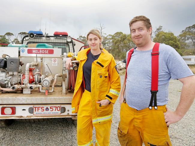 Volunteer firefighters Tara Felts, from Claude Road Fire Brigade, and Jackson Marshall, from Sheffield Fire Station, after battling fires in the region. Picture: PATRICK GEE