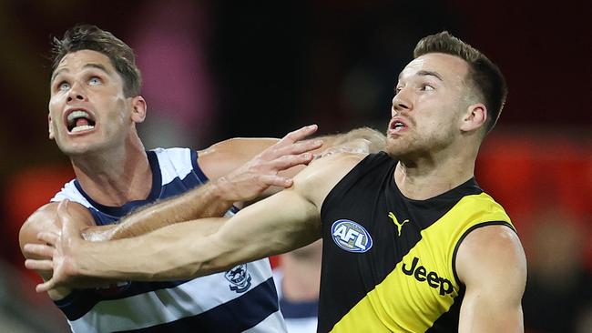 Noah Balta tangles with Tom Hawkins during Richmond’s Round 17 clash against Geelong.