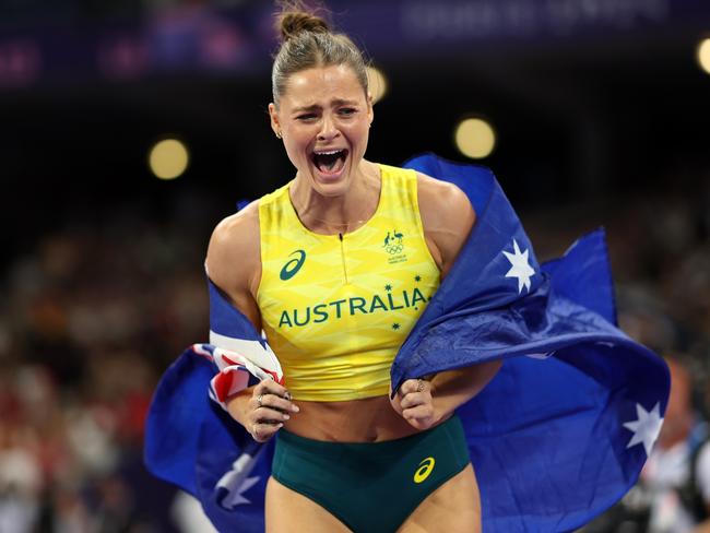 Nina Kennedy celebrates her gold medal in the pole vault. Picture: Cameron Spencer/Getty Images