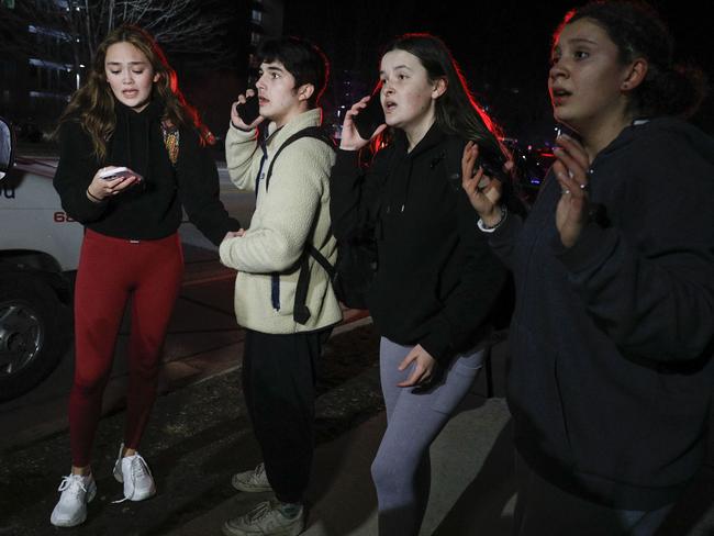 Michigan State University students react during an active shooter situation on campus in Lansing, Michigan. Picture: Getty Images