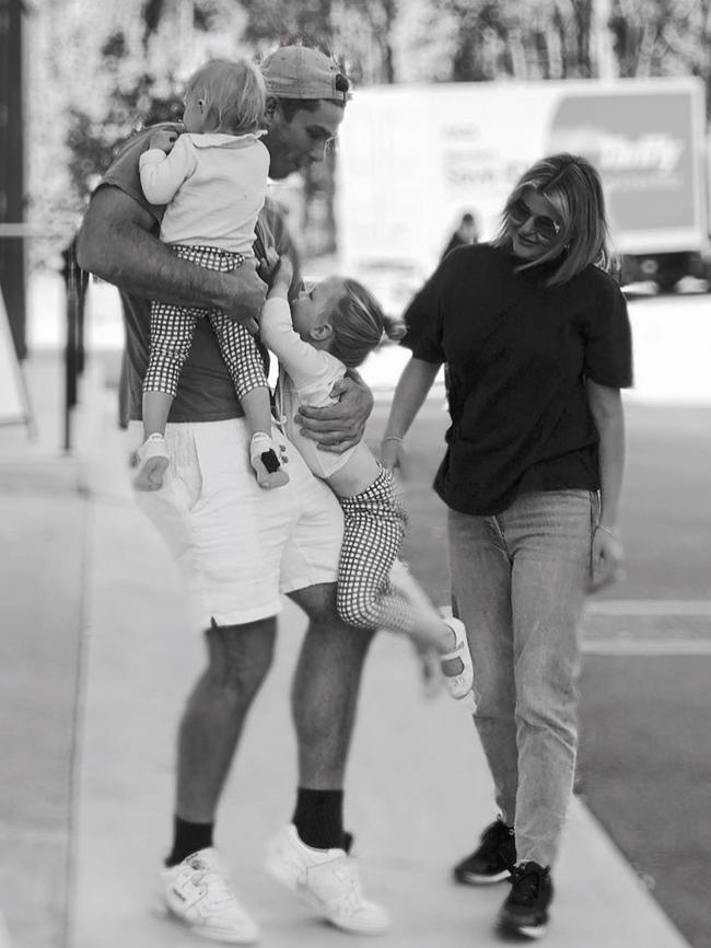 Tom Hawkins’ daughters hug him after six weeks apart. Picture: Emma Hawkins