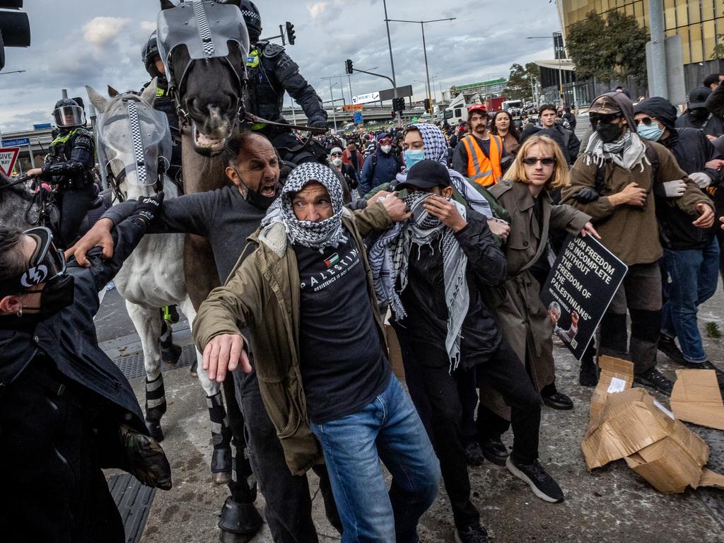 <p>Anti-war activists protest the Land Forces 2024 International Land Defence Exposition at the Melbourne Convention and Exhibition Centre. Police mounted unit charges protesters at South Wharf. Picture: Jake Nowakowski</p>