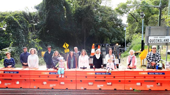 Mount Tomewin residents protest at the NSW / Queensland Border at Mount Tomewin along side local State member for Currumbin Laura Gerber. Photo Scott Powick Newscorp