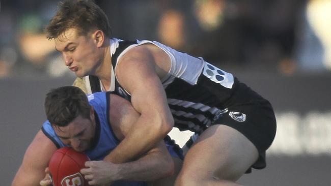 Port's Ollie Wines tackles Sturt's John Greenslade while returning to Port in the SANFL. Picture: AAP Image/Dean Martin