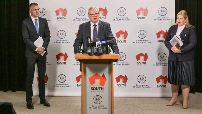 Former Police Commissioner Mal Hyde, centre releases parts of reports into the state’s child protection system, flanked by Premier Peter Malinauskas and Child Protection Minister Katrine Hildyard. Picture: NCA NewsWire / Brenton Edwards