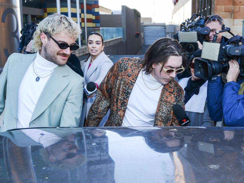 Cody Milne (left) and Tasman Binder put on a show for the media outside the Adelaide Magistrates Court when they first appeared in late June. Picture: Brenton Edwards