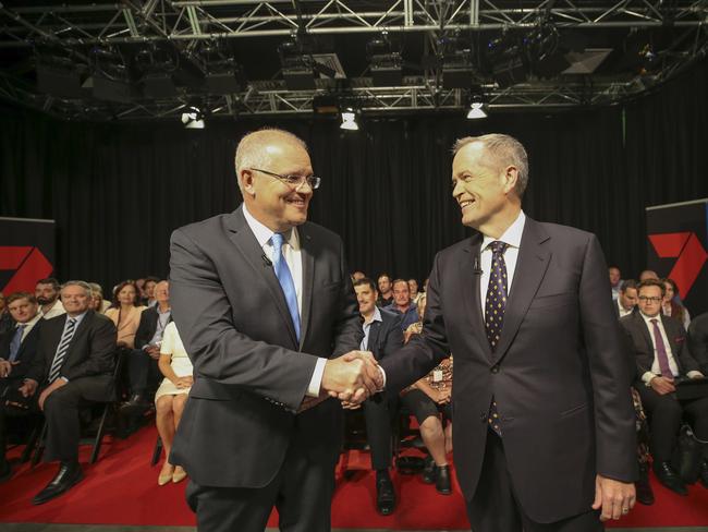 Australia's Prime Minister Scott Morrison (L) and opposition leader Bill Shorten shake hands before the first televised leaders debate in Perth on April 29, 2019. - The two men vying to lead Australia for the next three years faced off over the economy and plummeting trust in politicians in a testy first televised debate on April 19. (Photo by NIC ELLIS / POOL / AFP)