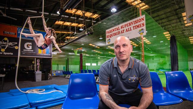 Zahnee, 19, and dad Zac Kimmel, of Oakleigh Indoor Sports and Inflatables, at his venue which has been closed and will remain so even after the latest changes. Picture: Jason Edwards