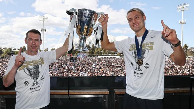 McRae and captain Darcy Moore hold up the 2023 premiership cup on Sunday. Picture: Michael Klein