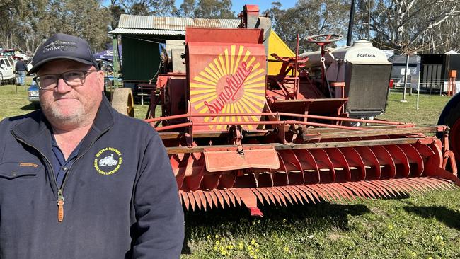 Andrew Newton of Walbundrie, NSW, is pictured with a Sunshine Header from 1925 that is owned by Kerry Peach of Pleasant Hills, NSW. Picture: Nikki Reynolds