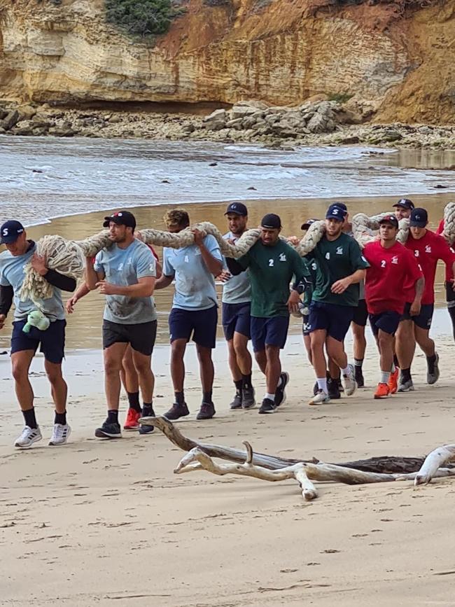 Storm players working together on the beach at Anglesea. Picture: Supplied.