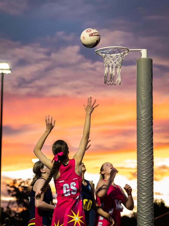 MBC shoot for goal in QGSSSA netball action. photographer David Pearce.