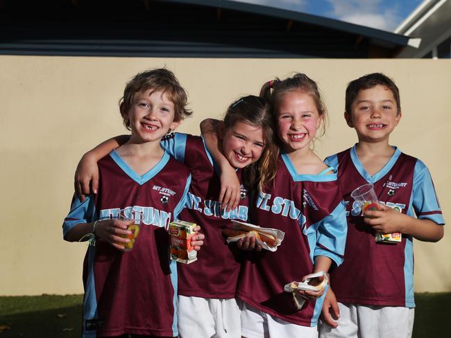 L-R Hamish Osborne 7, Olivia Sharples 7, Suiki Proud 6, Willis Owens 7 who are all in grade 1. At the Mount Stuart Primary School voting booth are some of the members of the Mount Stuart Primary School u/7's soccer teams enjoying sausages, lollies and drinks the school sold as a fundraiser for a new playground. Picture: NIKKI DAVIS-JONES